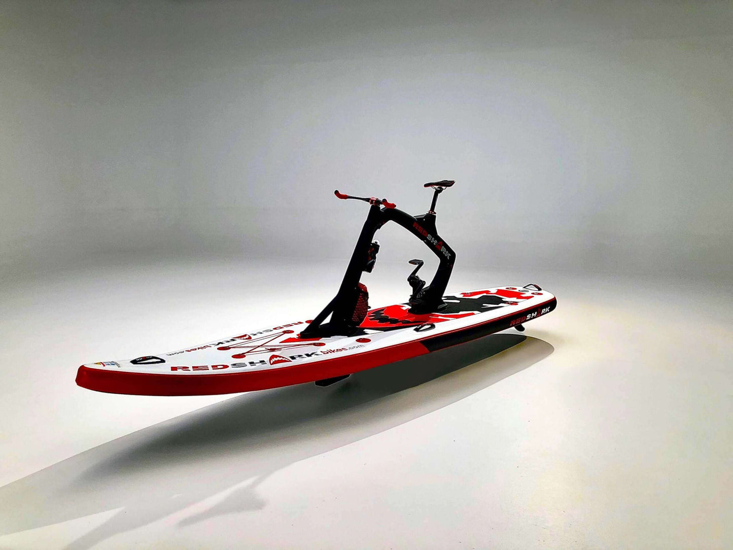 Red Shark Fitness water bike with black anthracite frame, designed for a unique aquatic workout experience.