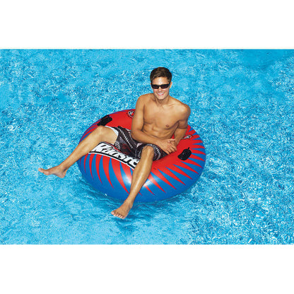 Person enjoying water on a Solstice Watersports 48" Radster Sport Tube in a sunny pool setting.